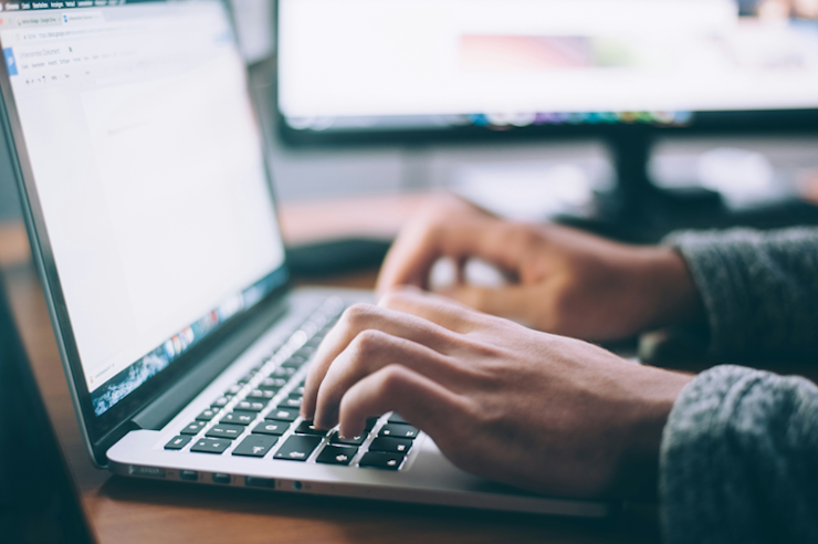 laptop with hands